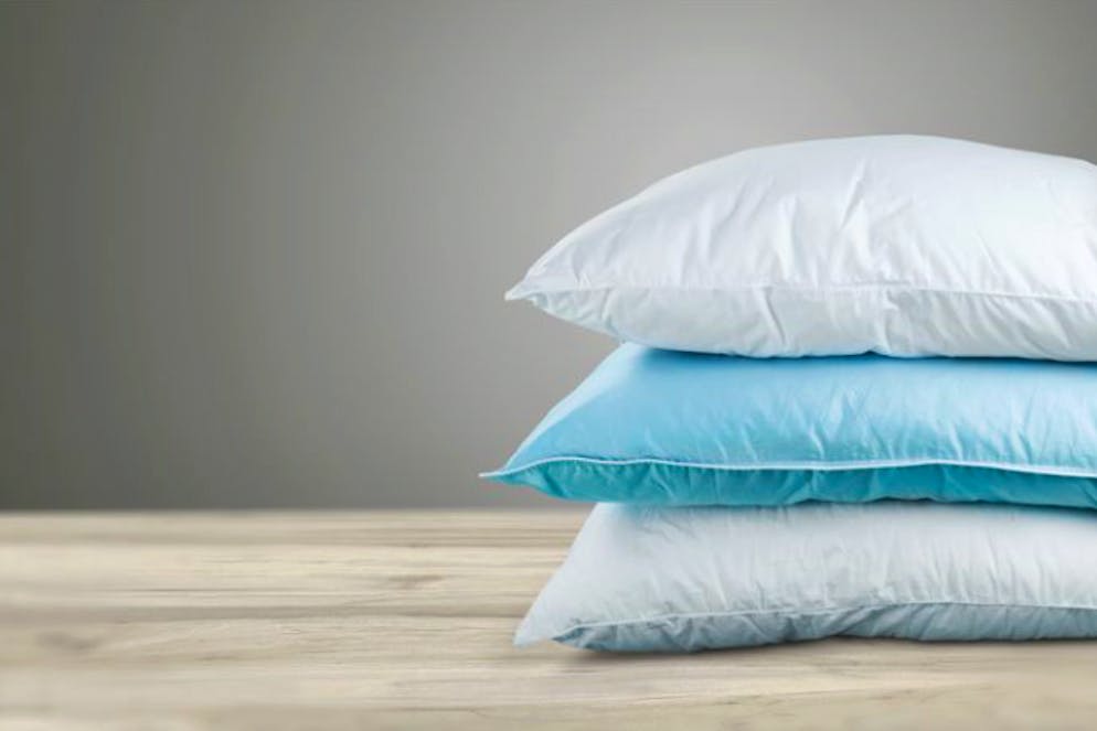 Tennisbälle schützen Daunen vor dem Verklumpen.