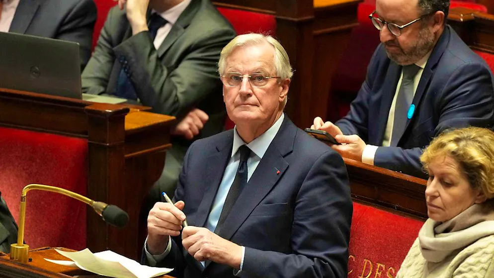 French Prime Minister Michel Barnier sits in the National Assembly as France's minority government may be on its last legs, with opposition MPs seeking a vote of no confidence this week. Photo: Michel Euler/AP/dpa