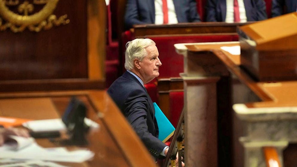 French Prime Minister Michel Barnier leaves the lectern in the National Assembly before the vote on a motion of censure. Photo: Michel Euler/AP/dpa