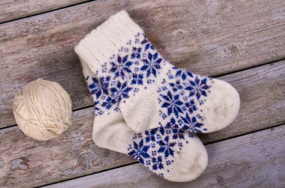 Willst du deine Wollsocken noch ein wenig tragen? Dann verzichte darauf, sie im Tumbler schnell trocknen zu lassen.