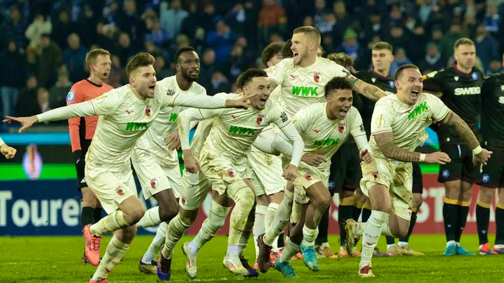 Goalscorer Ruben Vargas (center) celebrates with Augsburg in the Cup quarter-finals