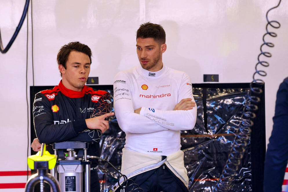Edoardo Mortara (right) in conversation with teammate and former world champion Nyck De Vries.