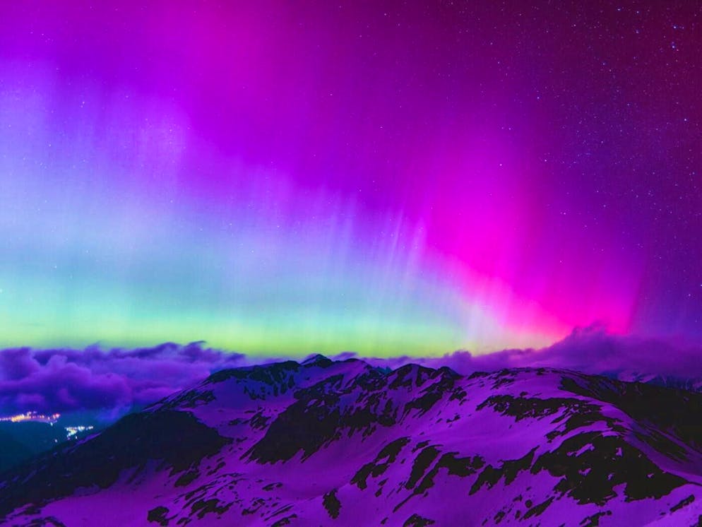 Auroras are often visible as green flowing curtains, but observers sometimes also see purple or reddish bands.