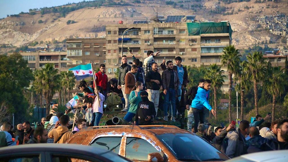 People celebrated the end of Bashar al-Assad's rule in Damascus on December 9.