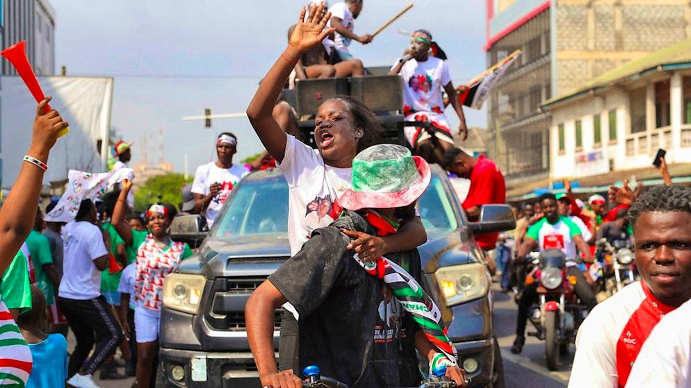 Supporters of opposition candidate and former president John Dramani Mahama celebrate their victory after Ghana's vice president and ruling party candidate Mahamudu Bawumia conceded defeat in Accra. Photo: Misper Apawu/AP