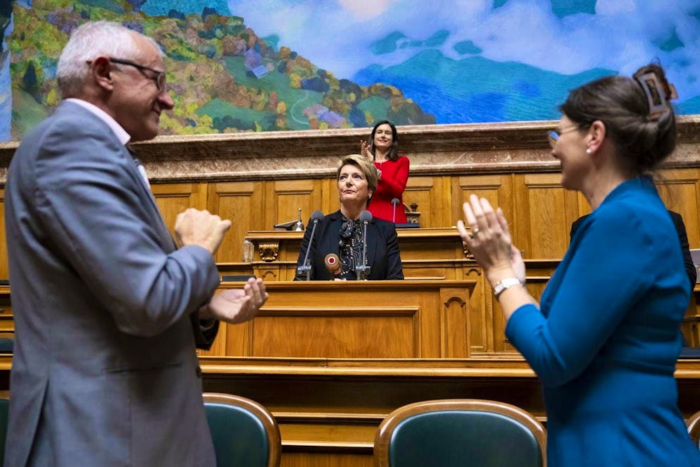 The newly elected President of the Swiss Confederation, Karin Keller-Sutter, receives applause from the United Federal Assembly.