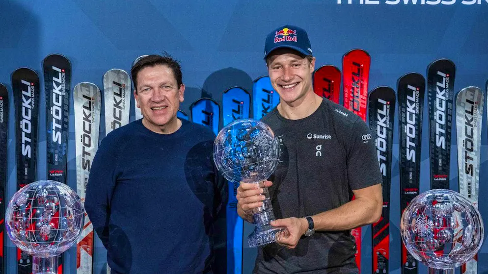Swiss ski star Marco Odermatt and his manager Michael Schiendorfer with three crystal globes.