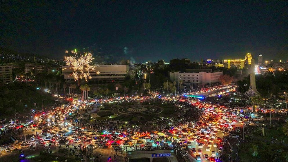 Fireworks are set off over Umayyad Square during the celebrations after the first Friday prayer since the fall of Bashar Assad. Photo: Ghaith Alsayed/AP/dpa