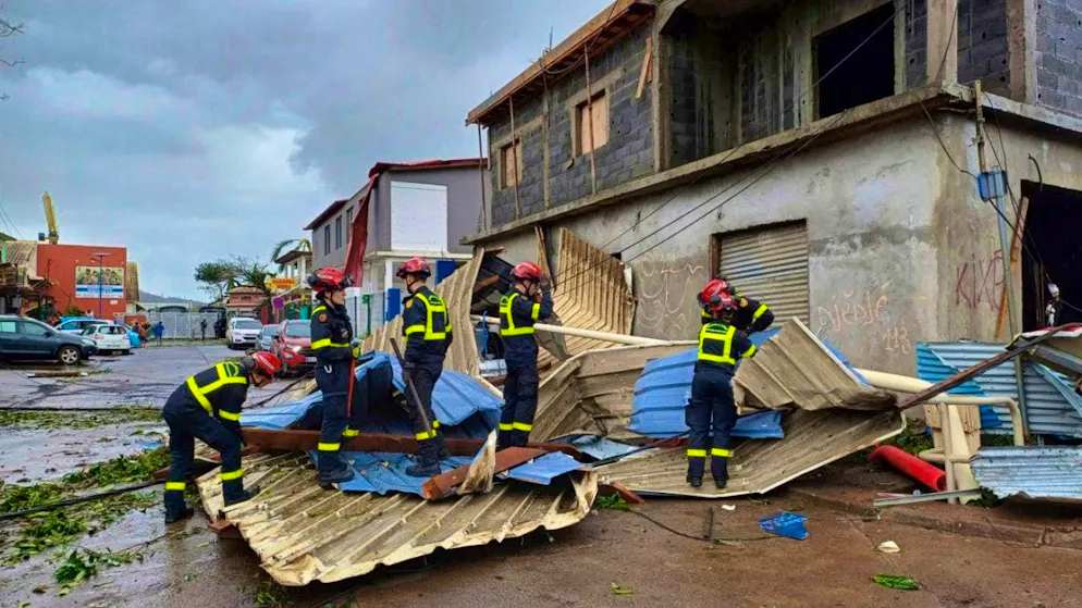 HANDOUT - This photo provided by Civil Security shows rescue workers clearing an area in the French territory of Mayotte in the Indian Ocean after Cyclone Chido caused extensive damage and several deaths on Saturday, Dec. 14, 2024. Photo: UIISC7/Securite civilevia AP/dpa - ATTENTION: For editorial use only and only with full citation of the above credit