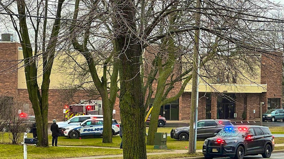 Emergency vehicles are parked in front of Abundant Life Christian School. At least three people have been killed in a gun attack at a school in the US state of Wisconsin, according to corrected police reports. Photo: Scott Bauer/AP/dpa