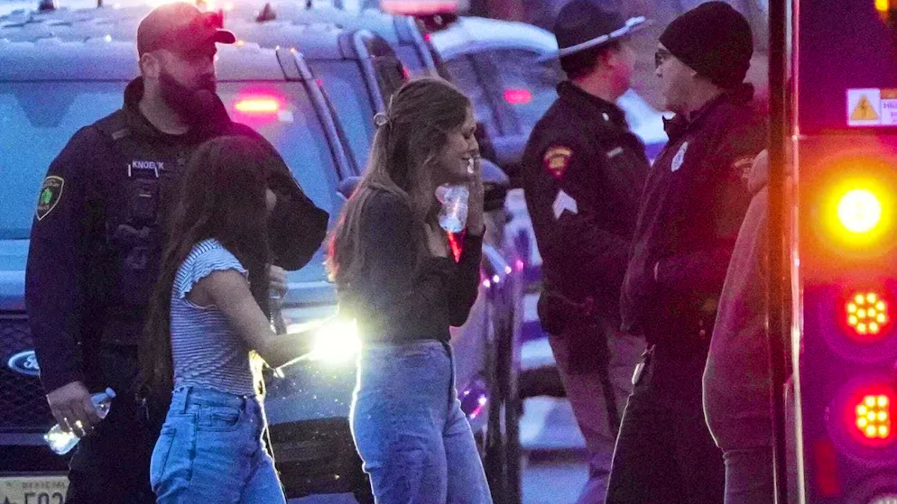 Students at the Christian school in Wisconsin board a school bus after Monday's shooting.
