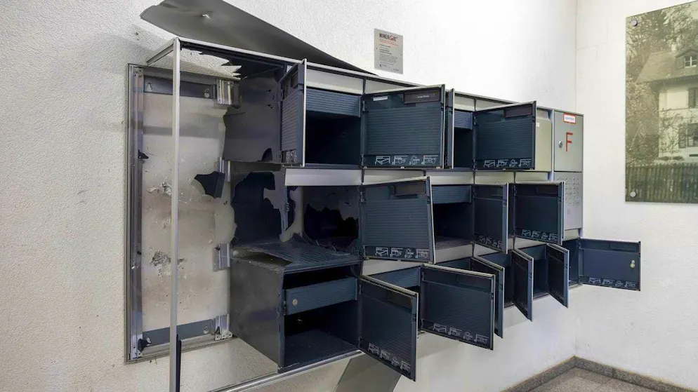 The letterboxes in the entrance hall of a residential building in the Grange-Canal district of Geneva, which were badly damaged by a parcel bomb in November. 