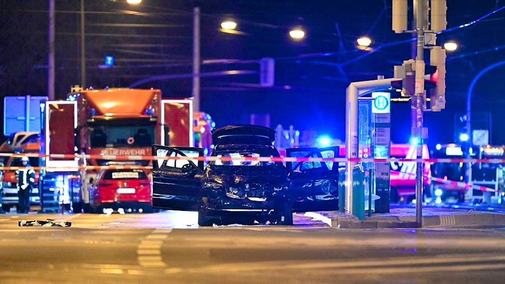 dpatopbilder - A car in which a perpetrator is said to have driven into a crowd of people at the Christmas market in Magdeburg stands with its doors open near the scene of the crime. Photo: Hendrik Schmidt/dpa