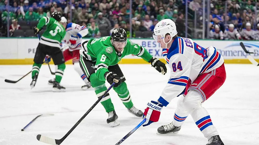 Lian Bichsel (in green/No. 6) in a duel with Adam Edström of the NY Rangers.