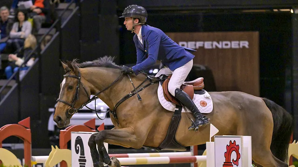 Steve Guerdat, the crest gives it away, on a round at the CHI Basel with Double Jeu