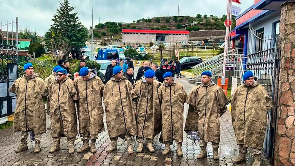 Turkish security forces stand guard next to parked ambulances at the entrance to a weapons factory after an explosion. Photo: Uncredited/IHA/AP/dpa
