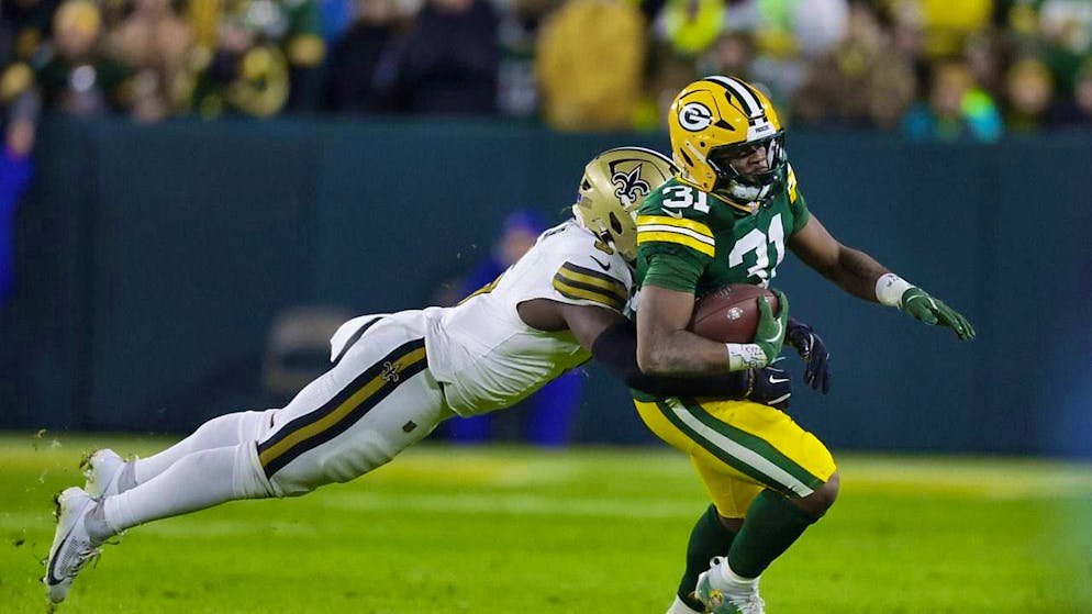 Outrunning the competition: Green Bay Packers running back Eanuel Wilson faster than the New Orleans defense.