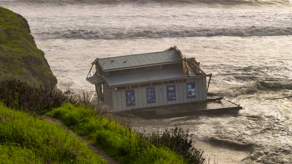 The remains of a washed away restaurant float in Monterey Bay in Santa Cruz. (December 23, 2024)