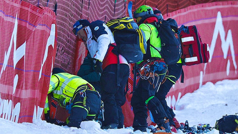 Helpers attend to Cyprien Sarrazin at the scene of the accident in Bormio.