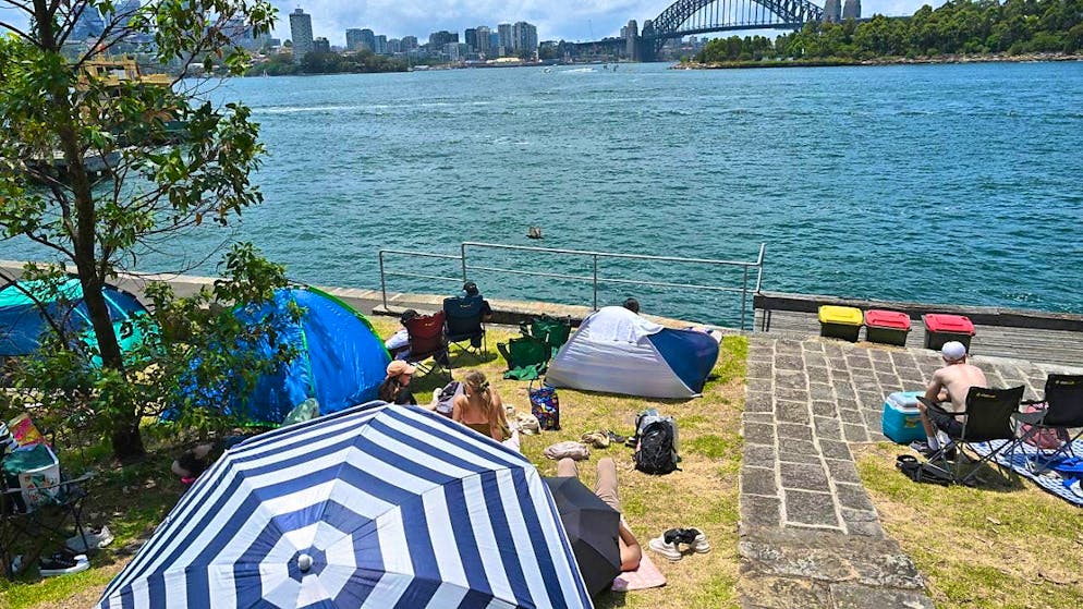 Sydney prepares for mega fireworks display - Gallery. Particularly keen fireworks fans have already pitched tents the night before and brought parasols to protect themselves from the intense sunshine.