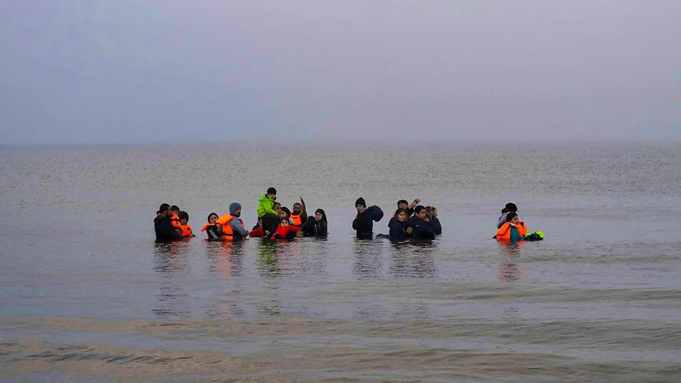 ARCHIVE - A group of Kurdish migrants from Iran and Iraq refuse to return to land on the beach at Ambleteuse in northern France. Photo: Bernat Armangue/AP/dpa/Archive image