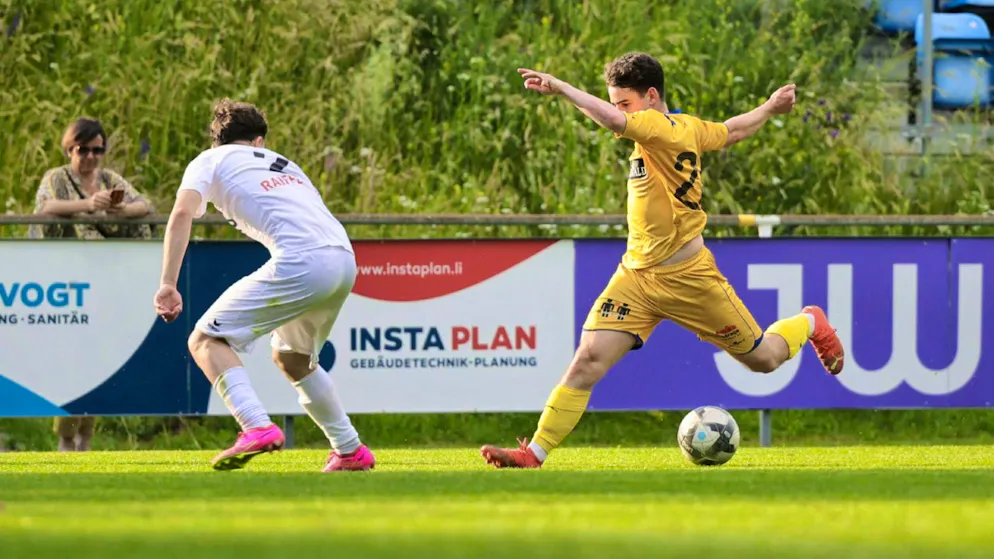A player from FC Balzers takes a dribble.
