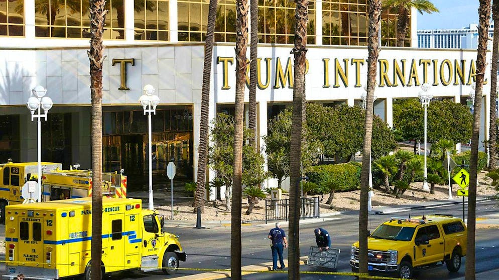 dpatop images - Clark County Fire Department responders work outside the Trump International Hotel in Las Vegas following the fire and explosion of a Tesla Cybertruck in the valet parking area. Photo: Sam Morris/Las Vegas Review-Journal/AP/dpa - ATTENTION: For editorial use only and only with full attribution to the above credit
