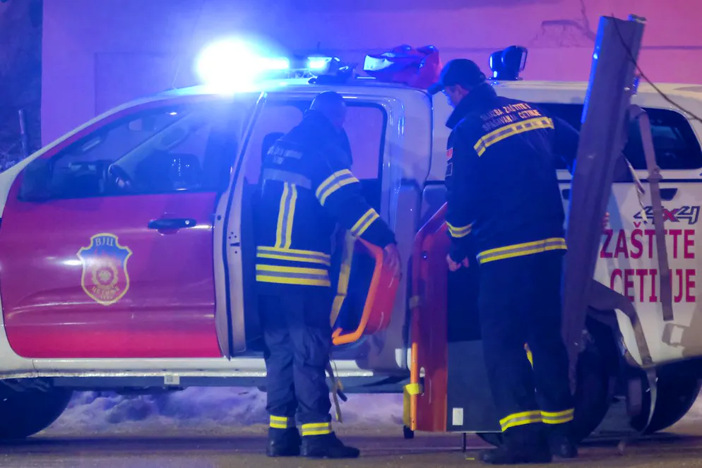 Rescue workers work at the site of a shooting in Cetinje, 36 kilometers (22 miles) west of Podogrica, Montenegro, Wednesday, Jan 1, 2025. (AP Photo/Risto Bozovic)