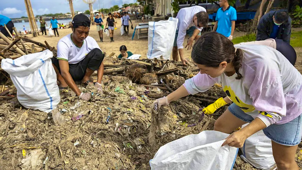 Hundreds of volunteers collected plastic waste from beaches in Bali on Saturday.