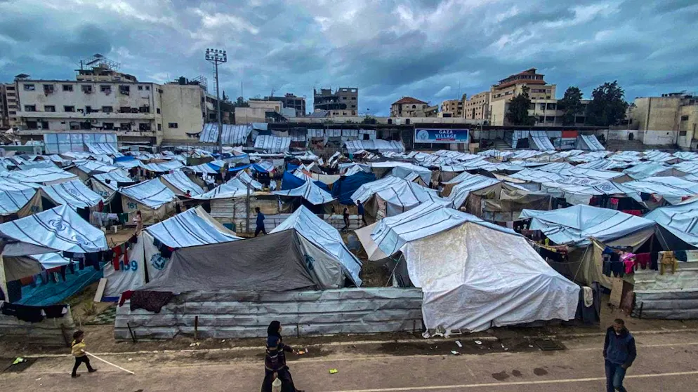 ARCHIVE - Palestinians who have been forced to leave their homes in northern Gaza and live in makeshift tents in Yarmouk Stadium are struggling to cope with the rain and cold weather in the region. Photo: Hadi Daoud Apaimages/APA Images via ZUMA Press Wire/dpa