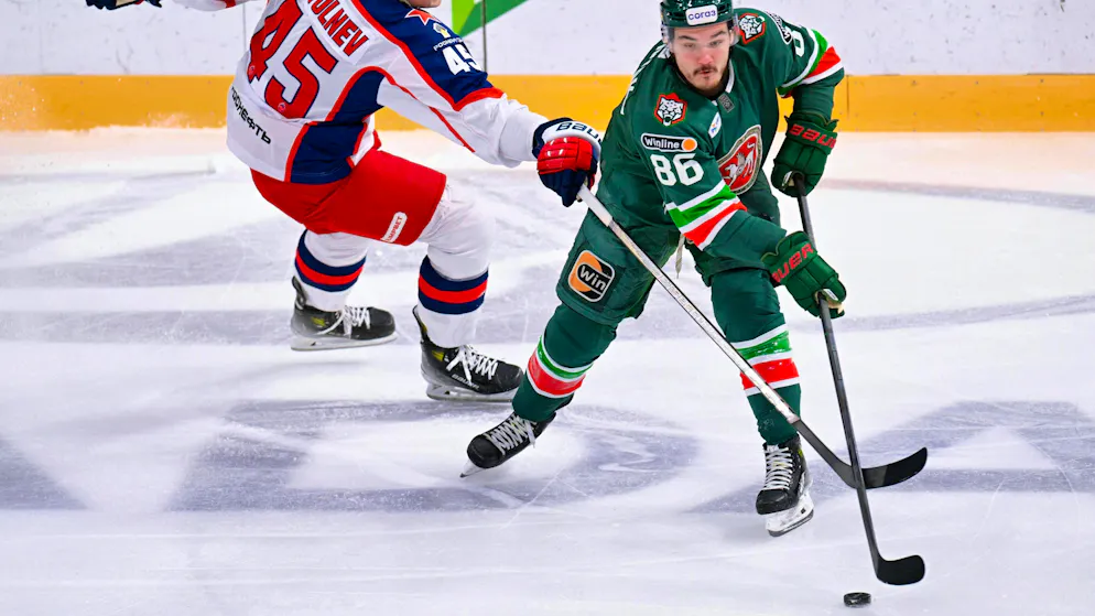 Nikita Dynyak in action - with puck, not cell phone.