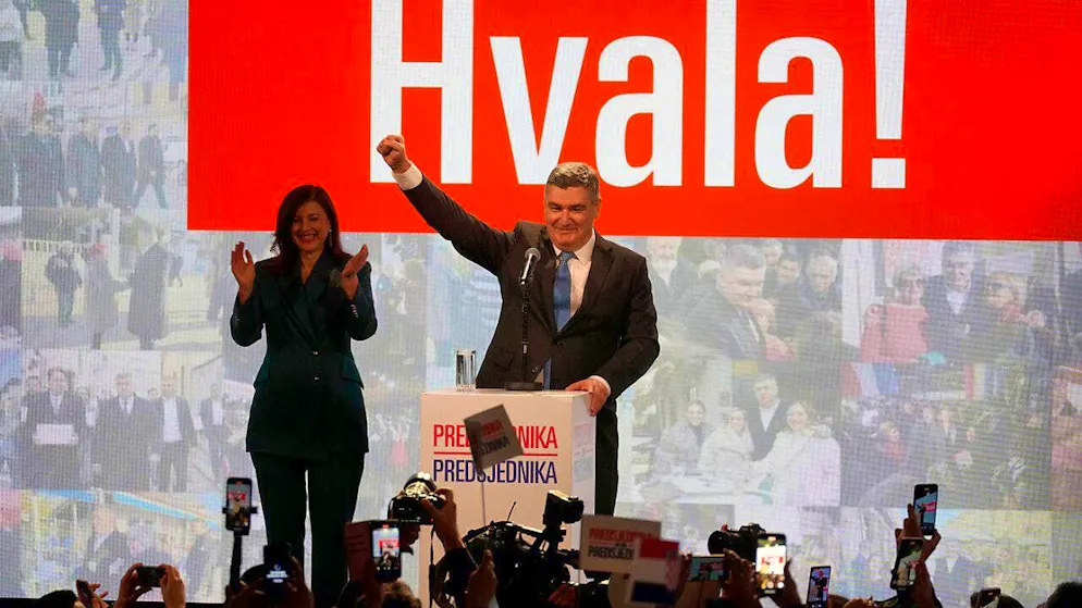 The incumbent President Zoran Milanovic with his wife Sanja Music Milanovic greets his supporters. The sign reads "Thank you". Photo: Darko Bandic/AP/dpa