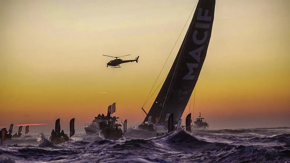 Dalin actually first this time - Gallery. Numerous escort boats and a camera team from the helicopter welcome Charlie Dalin