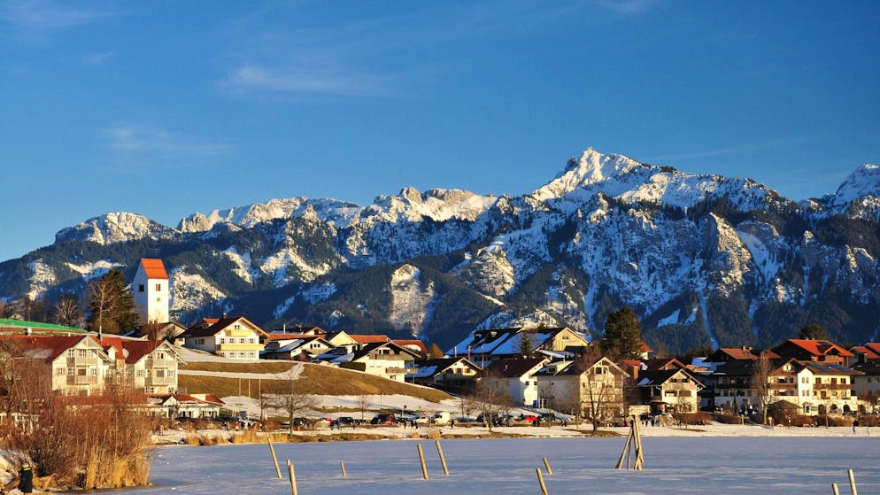 For a photo shoot. Tourist drives rental car onto frozen lake and breaks in
