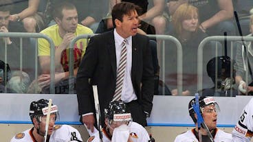 epa02702468 Germany's coach Uwe Krupp gives directions during an Ice hockey nation match between Germany and Belarus at Lanxess Arena in Cologne, Germany, 25 April 2011. EPA/FABIAN STRATENSCHULTE