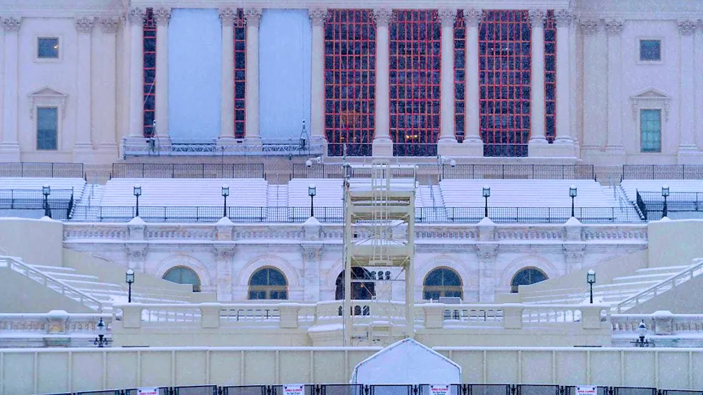 ARCHIVE - The west side of the US Capitol is surrounded by a double fence and covered in snow. Photo: Jose Luis Magana/AP/dpa