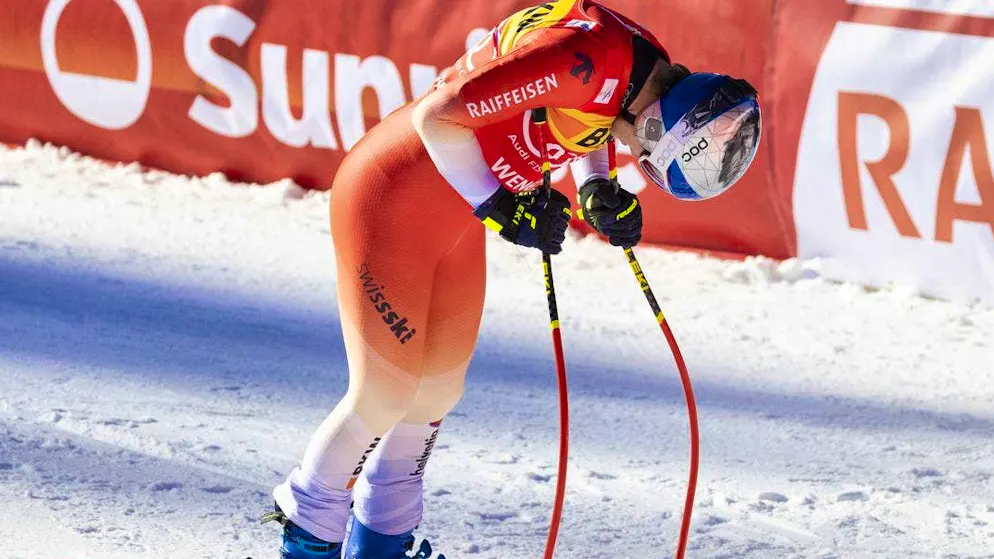Marco Odermatt with his head down in the finish area for once.