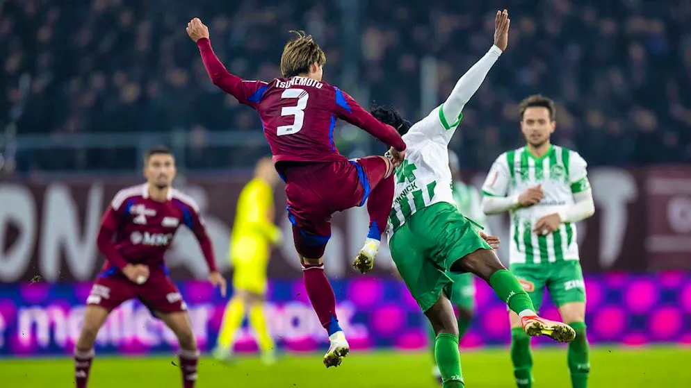 Servette's Keigo Tsunemoto and St. Gallen's Noah Yannick engage in a duel