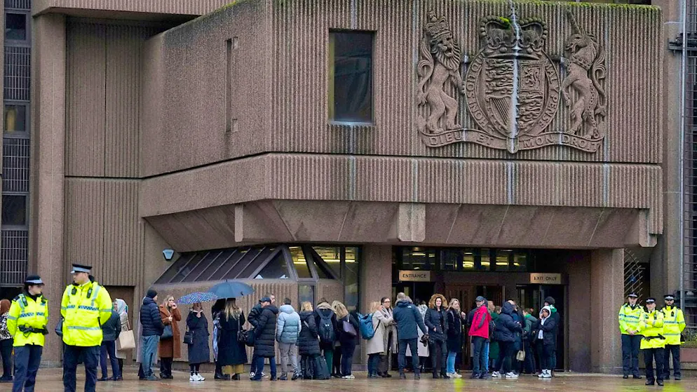 People outside Liverpool Crown Court, where the Southport trial is taking place. Photo: Jon Super/AP/dpa