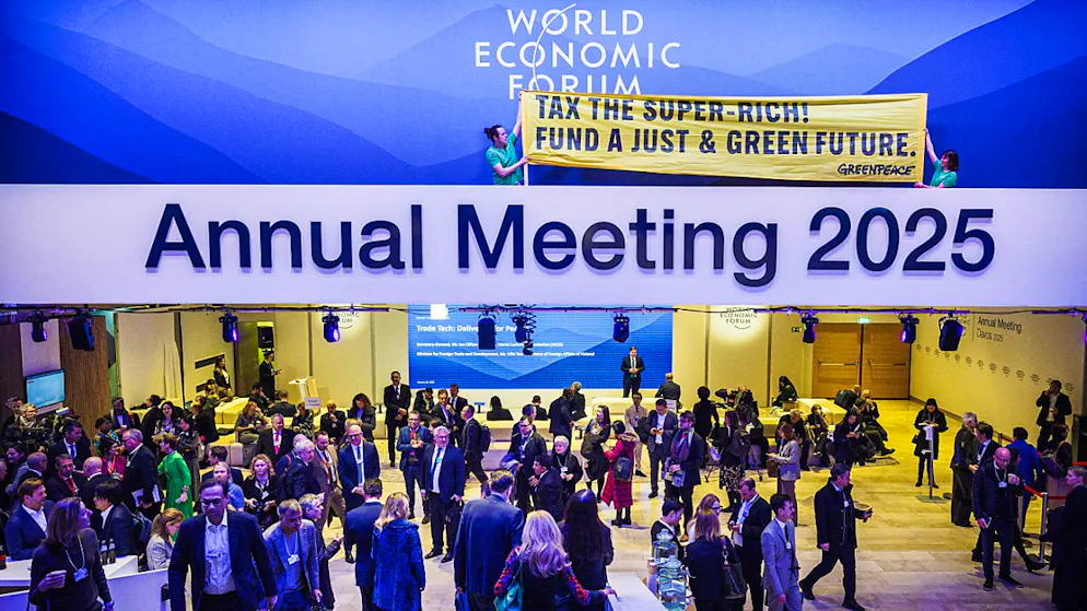 WEF ticker. Greenpeace activists smuggled themselves into the WEF as caterers