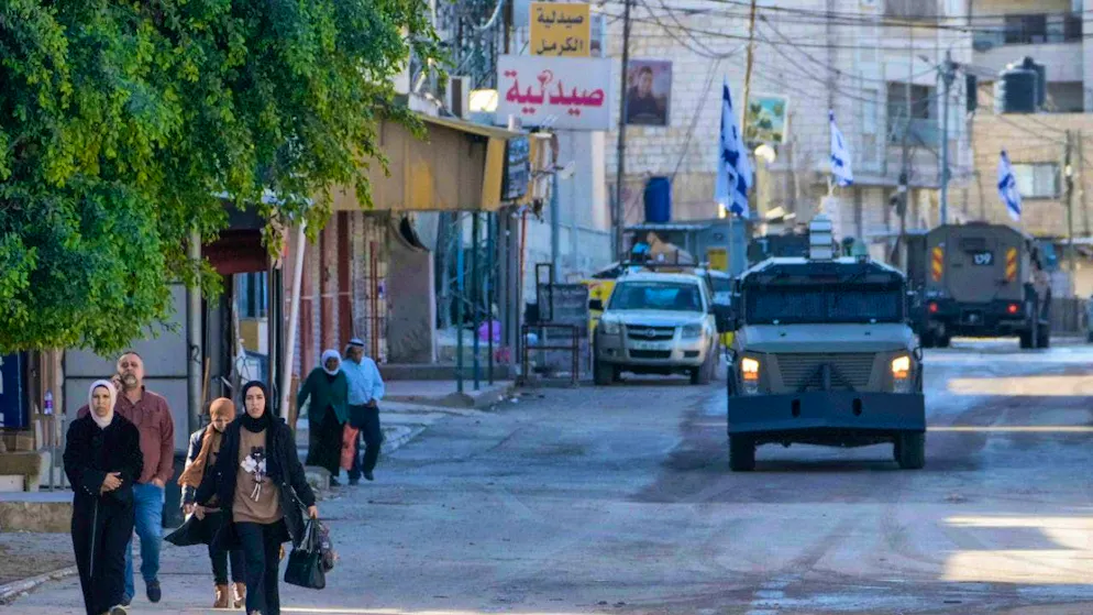 dpatop pictures - Israeli army vehicles are seen during a military operation in the West Bank city of Jenin. Photo: Majdi Mohammed/AP/dpa