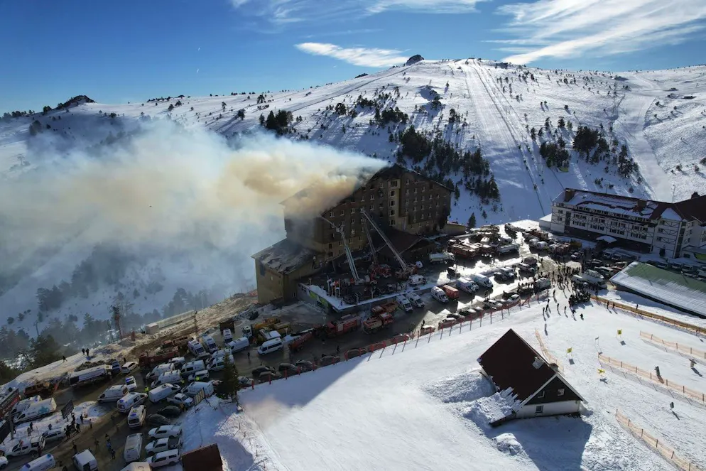 Firefighters work to extinguish a fire in a hotel at a ski resort of Kartalkaya, located in Bolu province, in northwest Turkey, Tuesday, Jan. 21, 2025. (Enes Ozkan/IHA via AP)