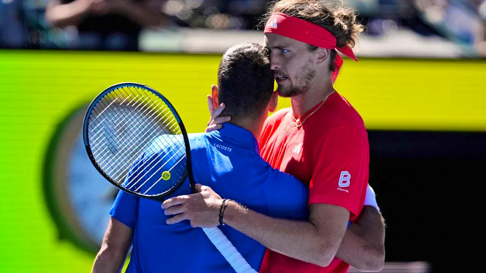 Alexander Zverev comforts Djokovic after his retirement.