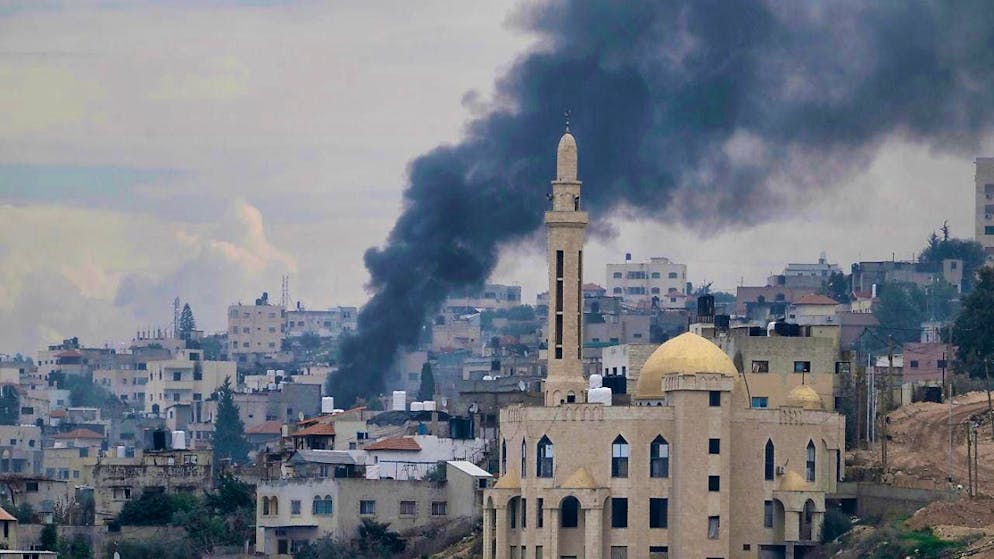 Smoke rises over the Jenin refugee camp in the West Bank during an Israeli military operation. Photo: Majdi Mohammed/AP/dpa