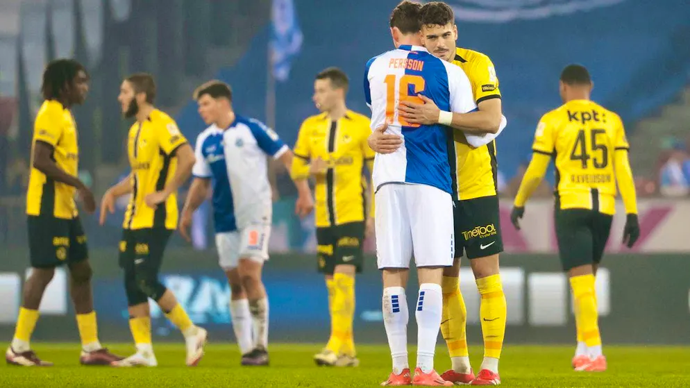 GC player Noah Persson hugs Filip Ugrinic from Young Boys after the final whistle.