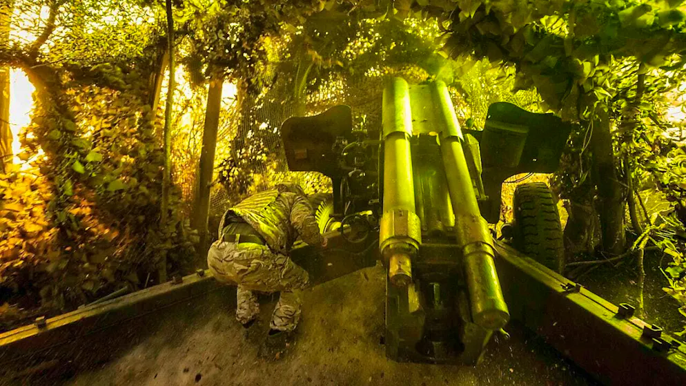 ARCHIVE - A Ukrainian soldier of the 14th Brigade of the National Guard "Chervona Kalyna" fires a D-20 artillery cannon at Russian positions on the front line in the direction of Pokrovsk, Donetsk region. Photo: Evgeniy Maloletka/AP/dpa