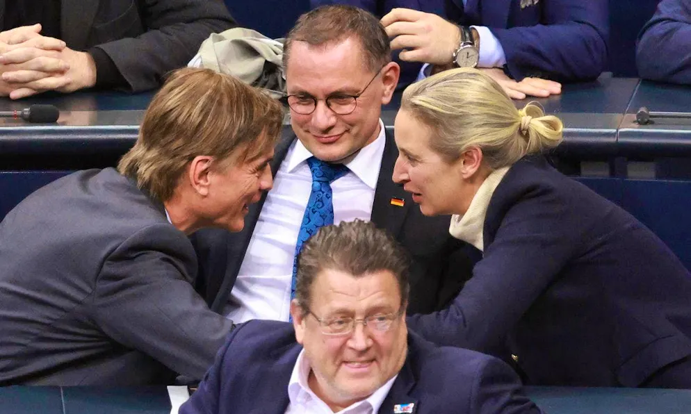 Migration vote leads to scandal - AfD celebrates - Gallery. AfD leader Alice Weidel next to Tino Chrupalla, co-chairman of the AfD party and parliamentary group (back), Stephan Brandner, deputy chairman of the AfD parliamentary group (front) and AfD parliamentary group member Bernd Baumann (l.)