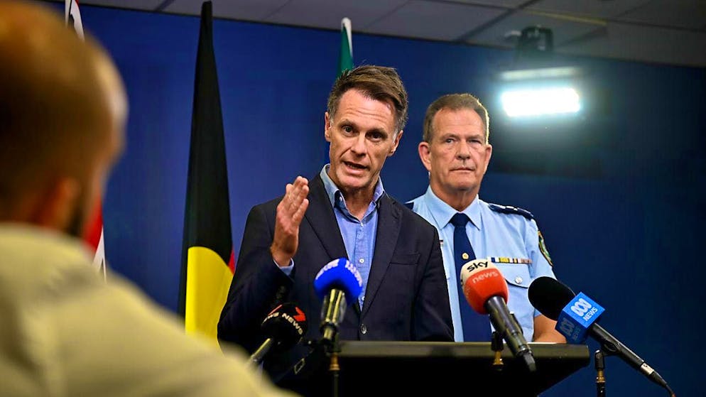 New South Wales Premier Chris Minns speaks to the media during a press conference, with New South Wales Deputy Police Commissioner David Hudson on the right. Photo: Steven Saphore/AAP/dpa