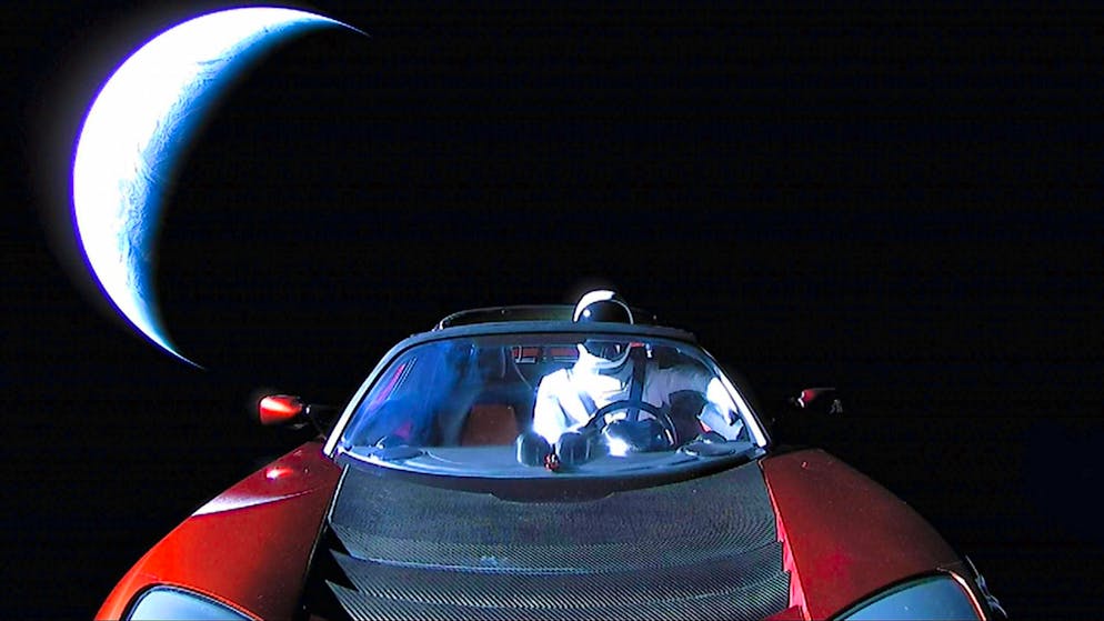 "Starman" in the driver's seat of SpaceX CEO Elon Musk's Tesla Roadster, traveling through space towards Mars.