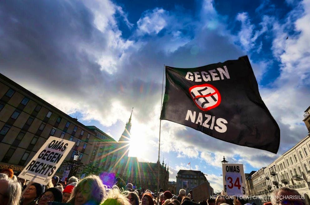 Participants in a protest under the slogan "Human chain against the AfD and its misanthropic policies" demonstrate in Hamburg city center.